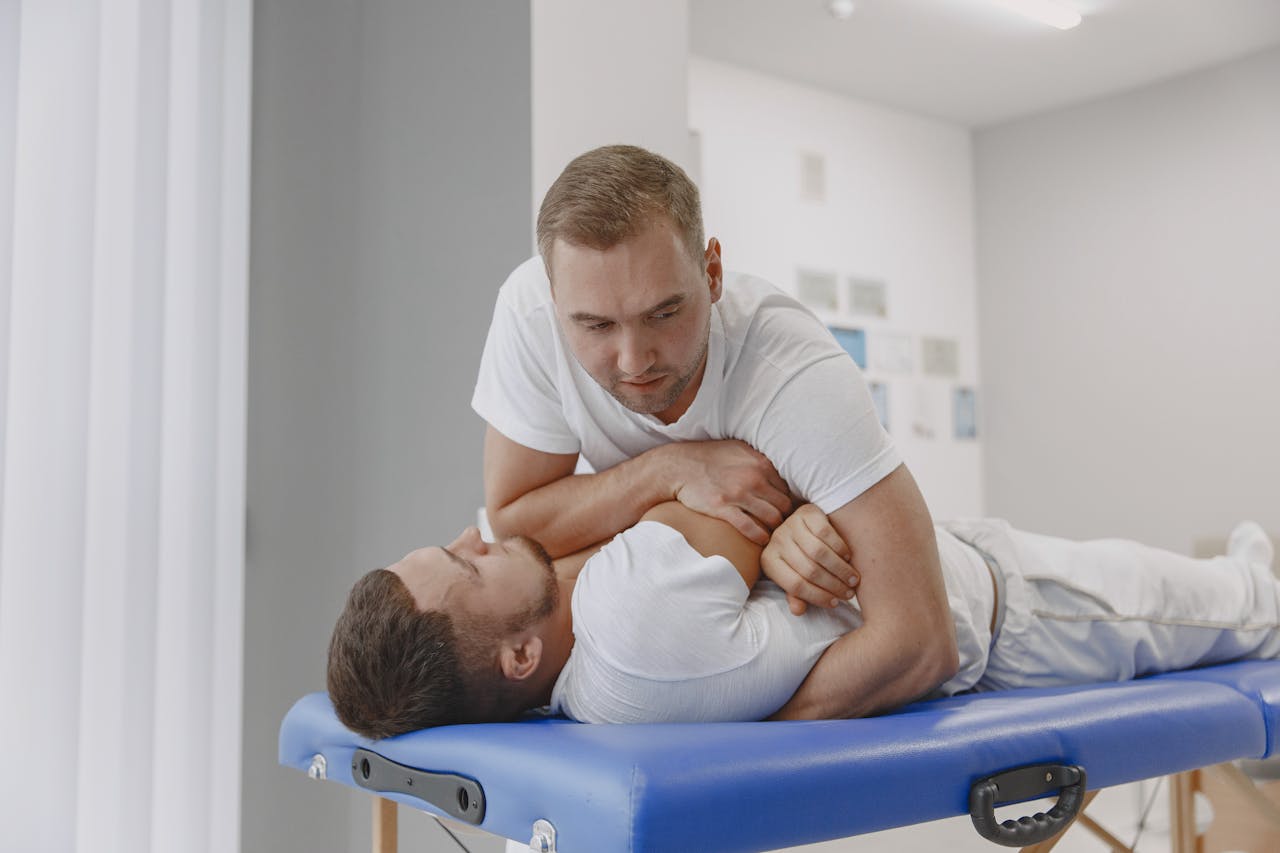 about-img A massage therapist performing a body massage for relaxation in a professional setting.